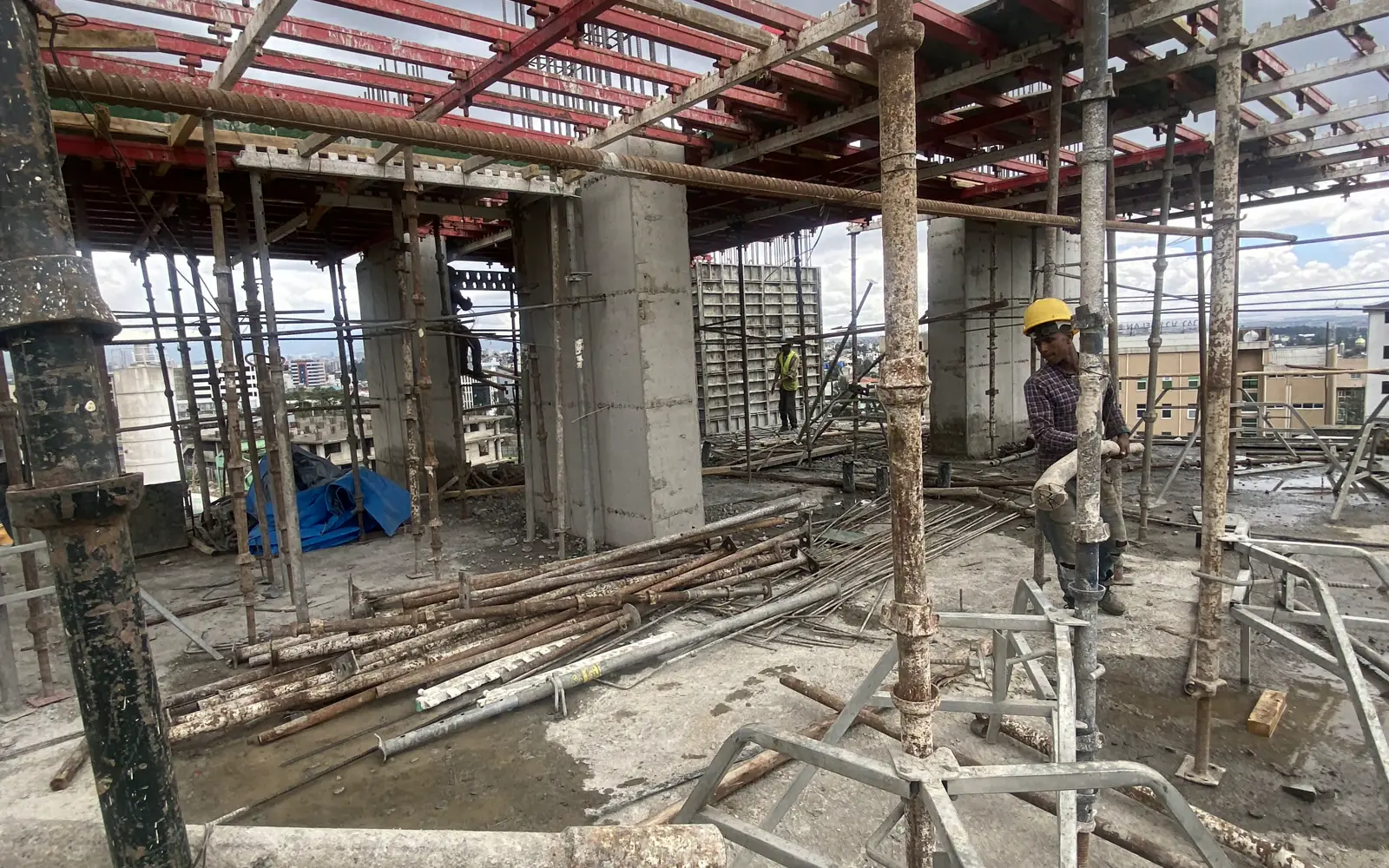 Elevated slab formwork and temporary supports on an active site